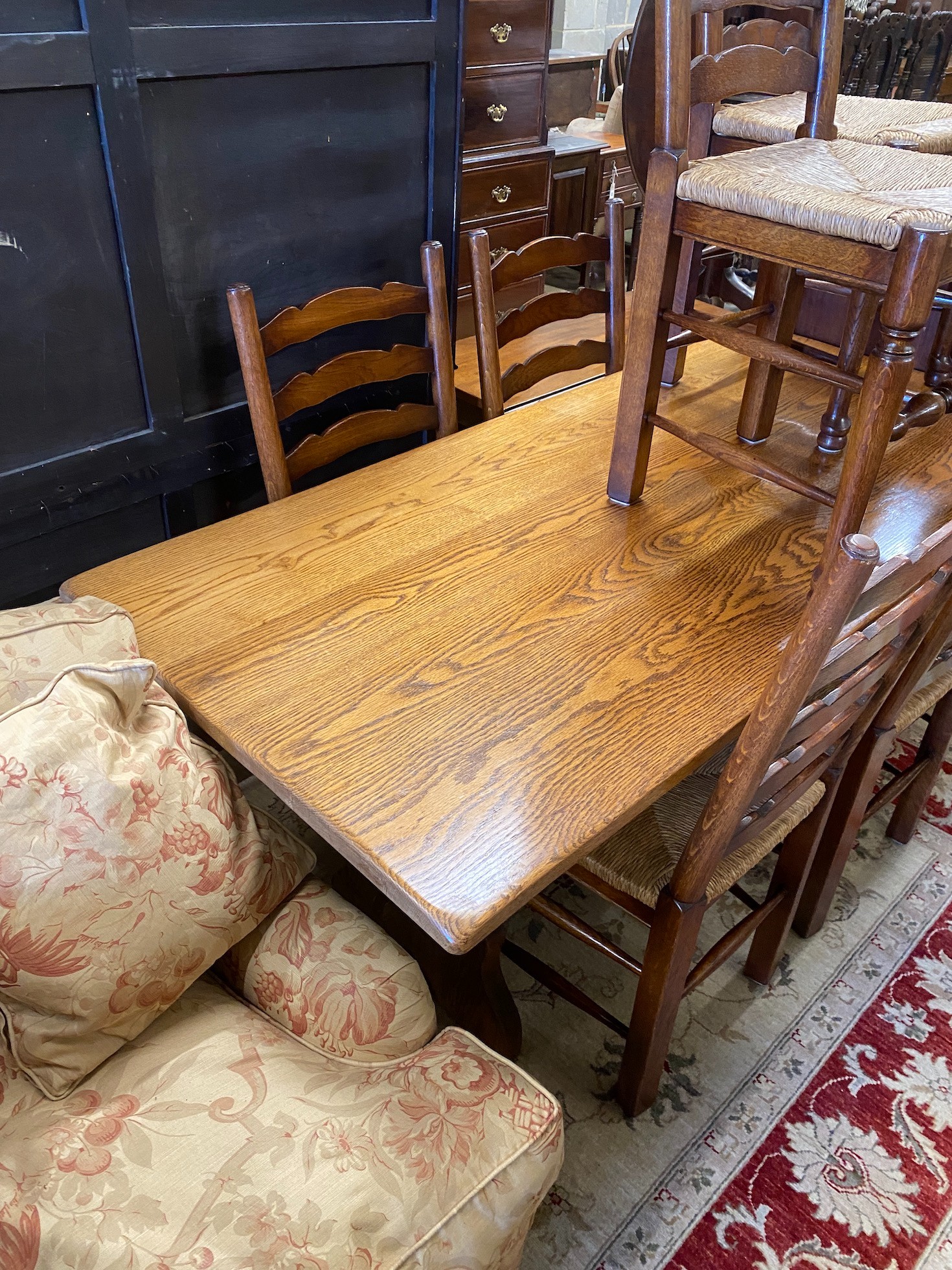 An 18th century style rectangular oak refectory dining table, length 167cm, depth 78cm, height 74cm and six ladderback rush seat dining chairs